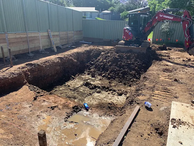 Excavator on a bulk dig, basement-scale excavation