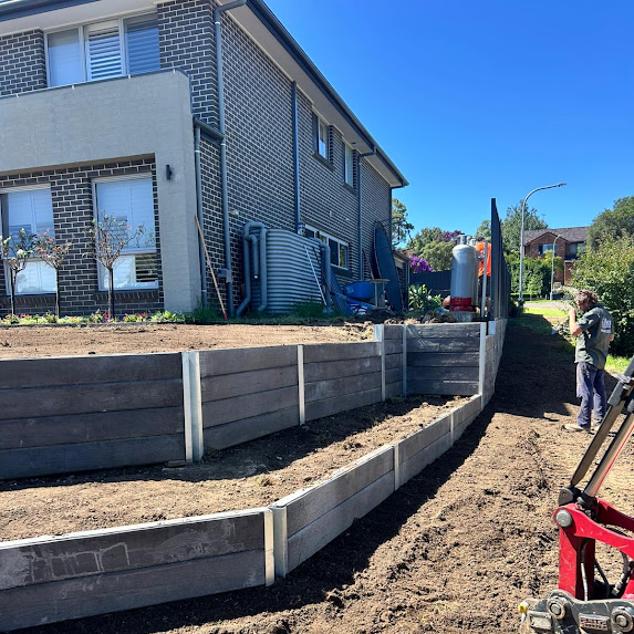 Finished sleeper retaining wall built on drilled piers